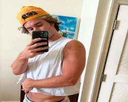 He has several small tattoos on his arm.